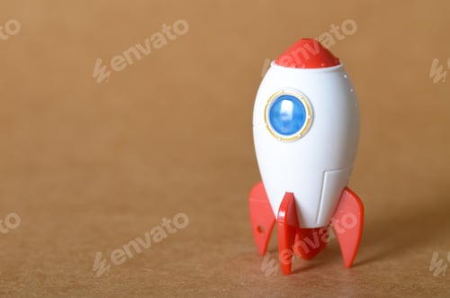 Preview: Business Startup and Rapid Growth Concept with Toy Rocket