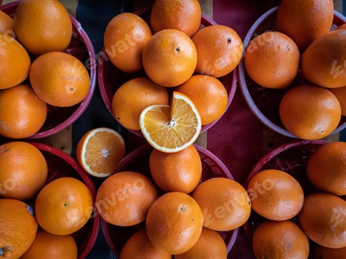 Preview: Top view of oranges in the basket at the market.