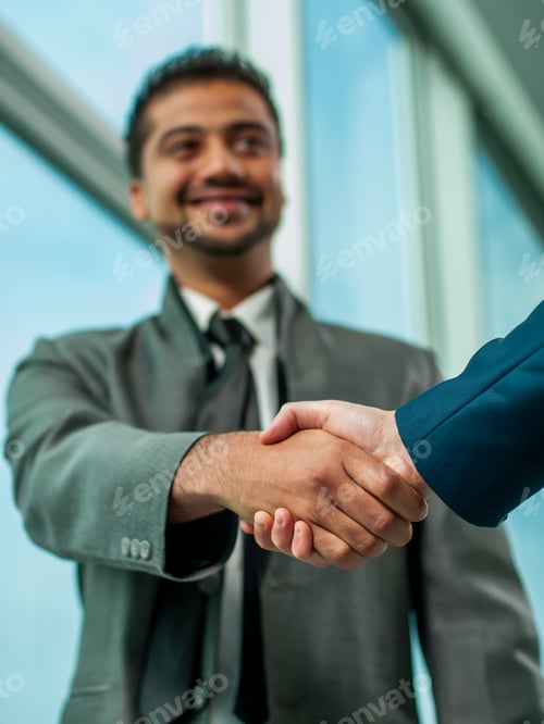 Preview: Business Handshake In Modern Office.