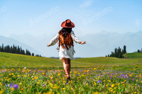 Preview: Young solo woman traveler relaxing and enjoying beautiful Scenery landscape with colorful flowers in