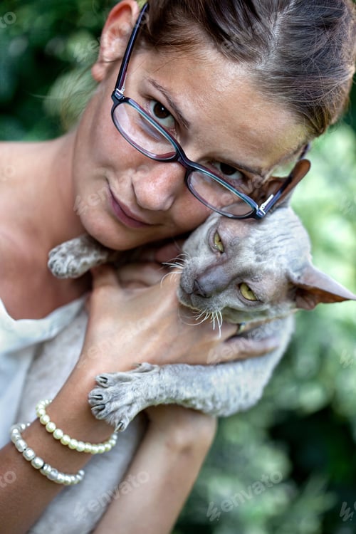 Preview: A girl and a cat in the garden