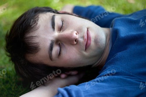 Preview: Man sleeping in a garden