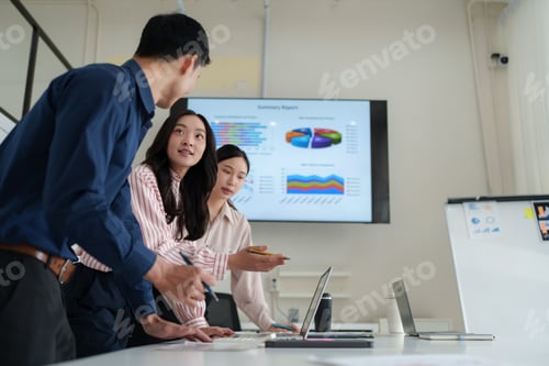 Preview: Business team analyzing data during corporate meeting