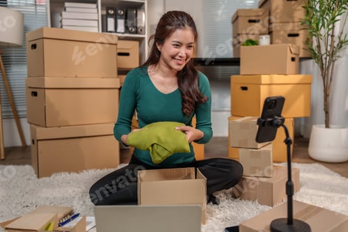 Preview: Asian woman online selling product from home on live stream