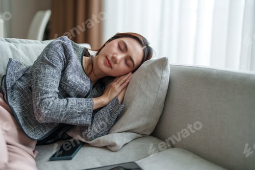 Preview: Tired businesswoman sleeping resting on sofa during break