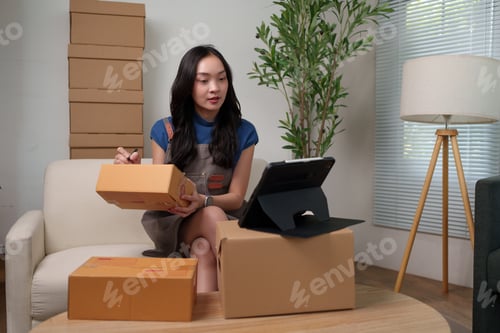 Preview: Woman preparing online orders for home delivery service