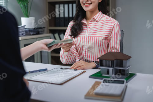 Preview: Client paying money to real estate agent for home