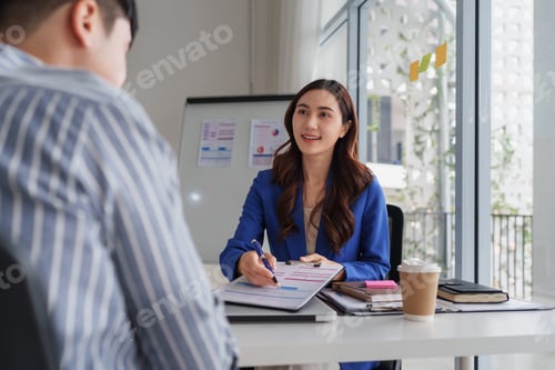 Preview: Businesswoman meeting client discussing planning agreement
