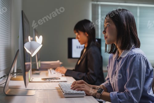 Preview: Business women working late hours in office