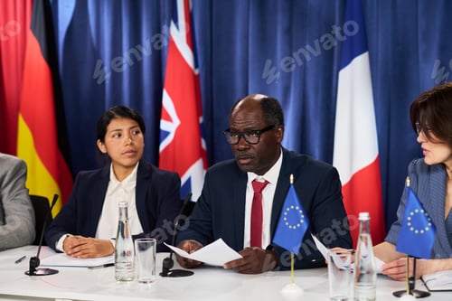 Preview: Black Middle Aged Man Speaking at International Press Conference