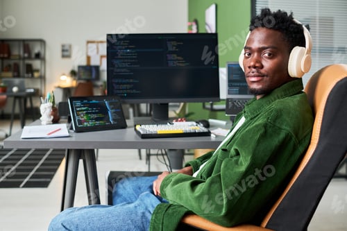 Preview: Portrait of Black Man Coding at Home Office for Remote Work