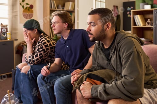 Preview: Diverse Students Watching Match Together in Shared Apartment