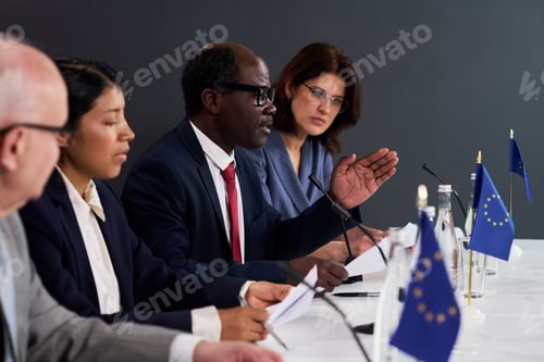 Preview: Diverse Business Team Discussing European Policy at Conference