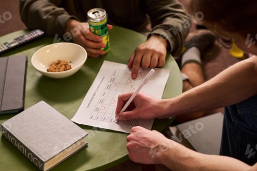 Preview: Teenage Students Completing Shared Apartment Chore Chart