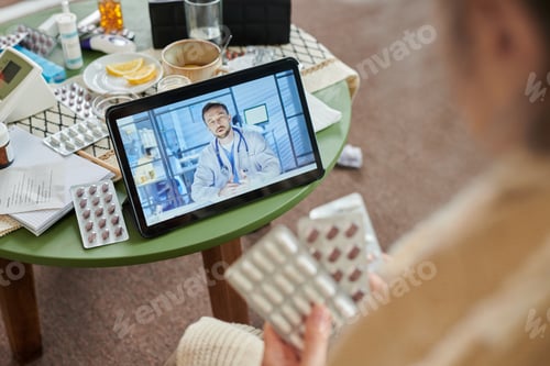 Preview: Senior Woman Having Online Doctor Consultation at Home