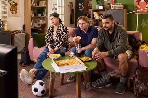 Preview: Multiethnic Friends Watching Television during Student Hangout