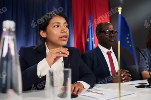 Preview: Hispanic Woman Speaking at Press Conference on International Policy