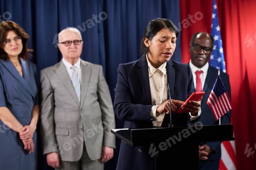 Preview: Hispanic Woman Politician Reading Speech at Campaign Podium