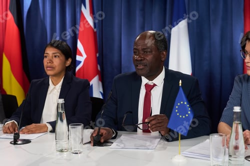 Preview: Black Businessman Speaking at International Diplomatic Meeting