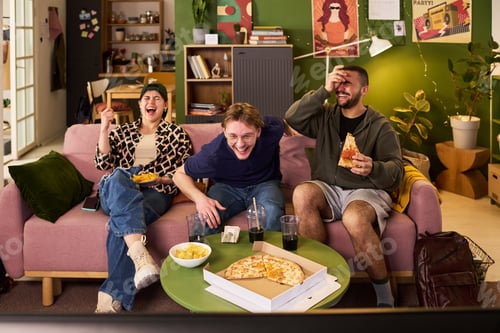 Preview: Young Friends Watching Tv and Eating Pizza in Student Apartment