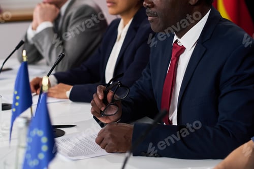 Preview: Black Middle Aged Man Speaking at Diplomatic Meeting