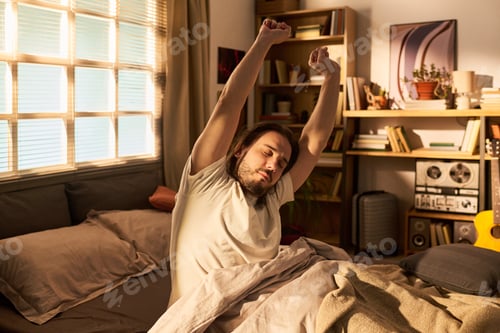 Preview: Adult Man Stretching in Bed during Morning Wake up Routine