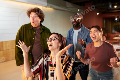 Preview: Diverse Adult Colleagues Celebrating Team Success in Office