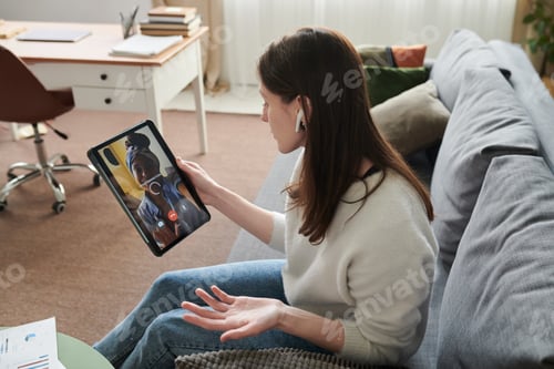Preview: Adult Woman Video Calling on Tablet during Remote Home Communication