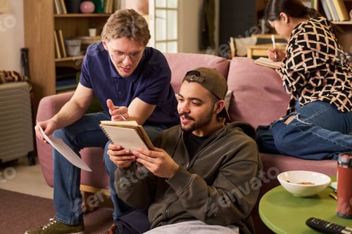 Preview: Diverse College Students Studying Together for Group Project at Home