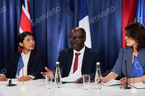 Preview: Diverse Diplomats Discussing International Policy at Press Conference