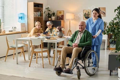 Preview: Senior Man with Disability Receiving Care in Nursing Home