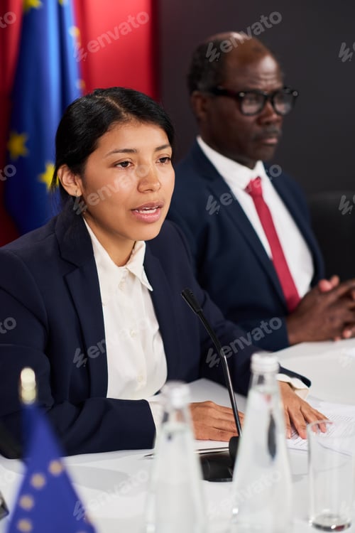 Preview: Hispanic Woman Speaking at Diplomatic Press Conference