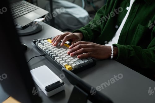 Preview: Black Adult Woman Typing on Keyboard for Remote Work