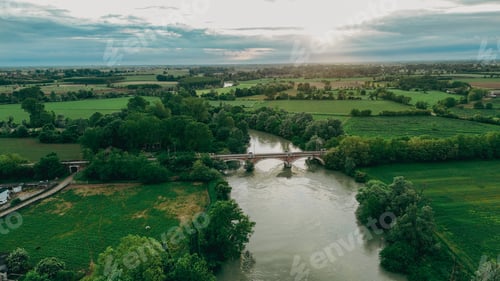 Preview: Captivating aerial view of the serene Oglio river winding through the picturesque countryside of Pon