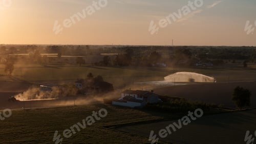 Preview: Po Valley farmland experiencing drought conditions, a tractor working the dusty fields, and an irrig