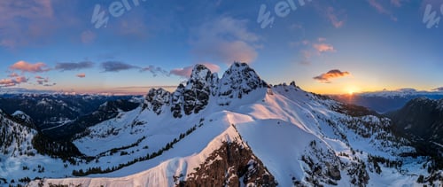 Preview: Snowy Mountain Sunset Panorama Over Rugged Peaks in British Columbia, Canada