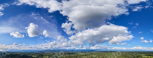 Preview: Panoramic Blue Sky With Dramatic White Clouds Over Fraser Valley Landscape, British Columbia, Canada