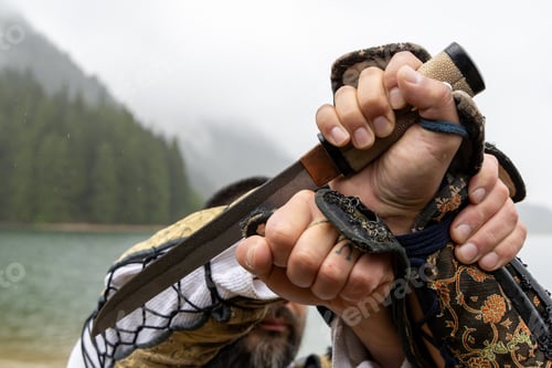 Preview: Samurai Holding Sword With Both Hands in Rain at Stave Lake Mission British Columbia Canada