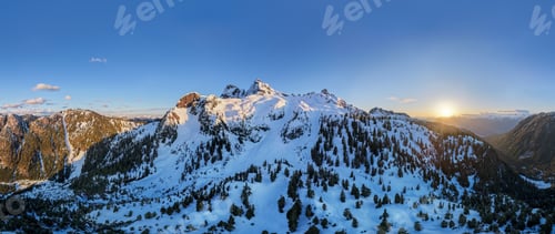 Preview: Snow-Capped Alpine Mountains at Sunset Over BC Backcountry in Canada — Pine Forest Panorama