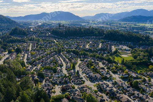 Preview: Aerial View of Promontory Suburban Neighborhood Overlooking Chilliwack Valley and Mountains in Briti