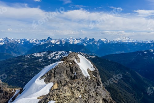 Preview: Panoramic Snow-Capped Mountain Peak and Rocky Summit Overlooking British Columbia, Canada Wilderness