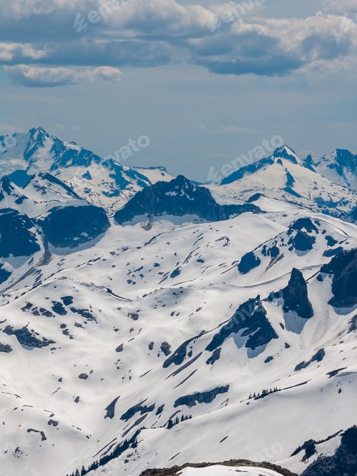 Preview: Snowy Mountain Range in British Columbia, Canada With Jagged Peaks and Expansive Alpine Snowfields