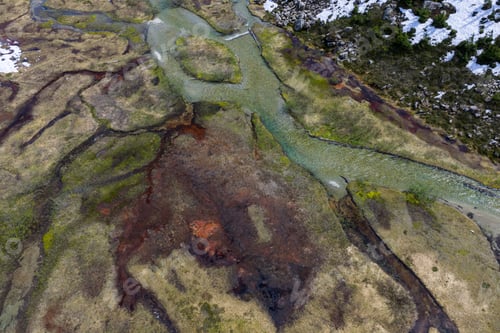 Preview: Aerial View of Meandering Mountain River and Marsh Wetland in British Columbia Spring Landscape