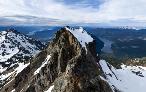 Preview: Snow-Capped Mountain Ridge Overlooking a Remote Lake in British Columbia, Canada