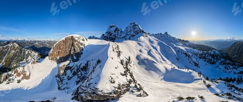 Preview: Snow-Covered Mountain Peaks Panorama at Sunrise in British Columbia, BC Canada Winter Alpine Landsca