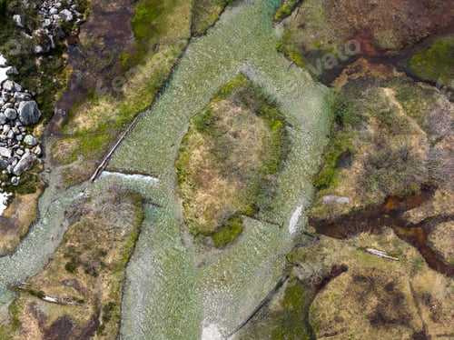 Preview: Aerial View of Braided Clear River and Wetland Marsh With Rocks and Moss in British Columbia Canada