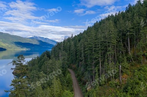Preview: Winding Forest Road Along Harrison Lake With Mountains and Evergreens Near BC, Canada Shoreline