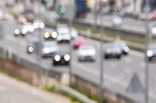 Preview: Blurred video background of busy cars with lights on on a highway, moving