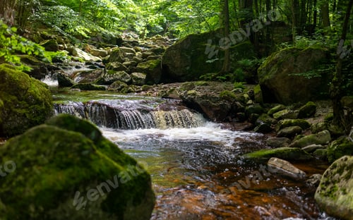 Preview: Peaceful Forest Stream with Mossy Rocks and Waterfall