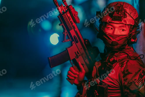 Preview: Military tactical team operates under red light at night inside dark abandoned building